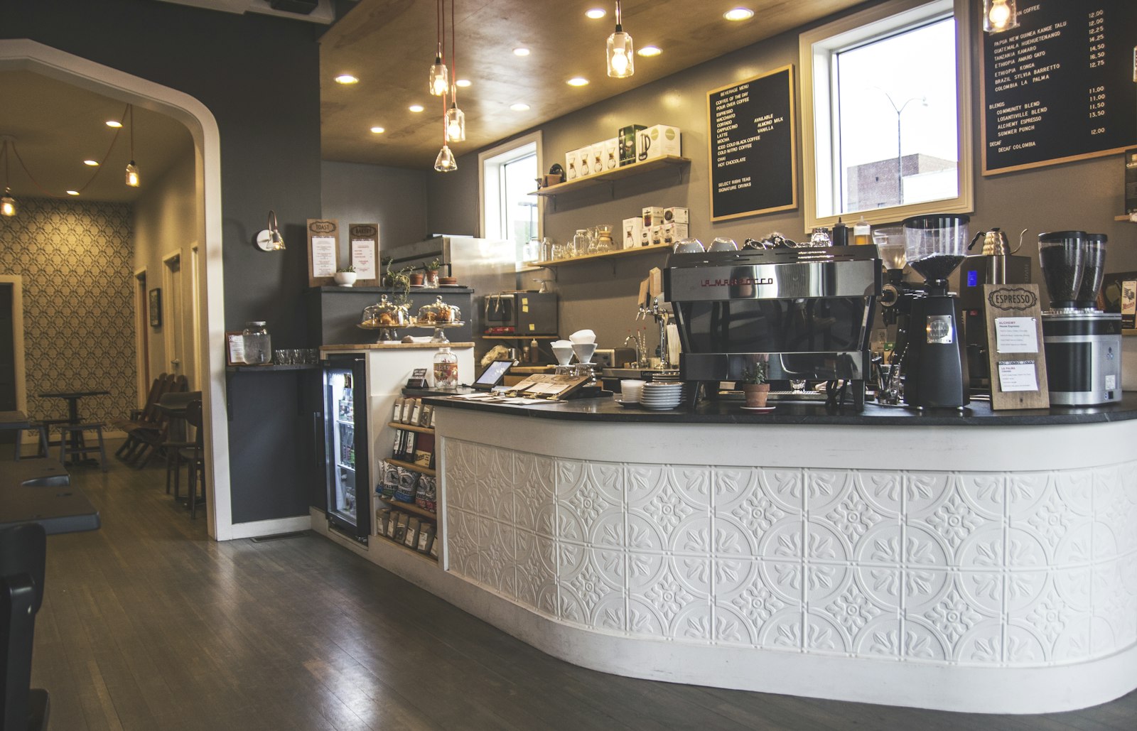 Coffee shop counter with an espresso machine and menu boards